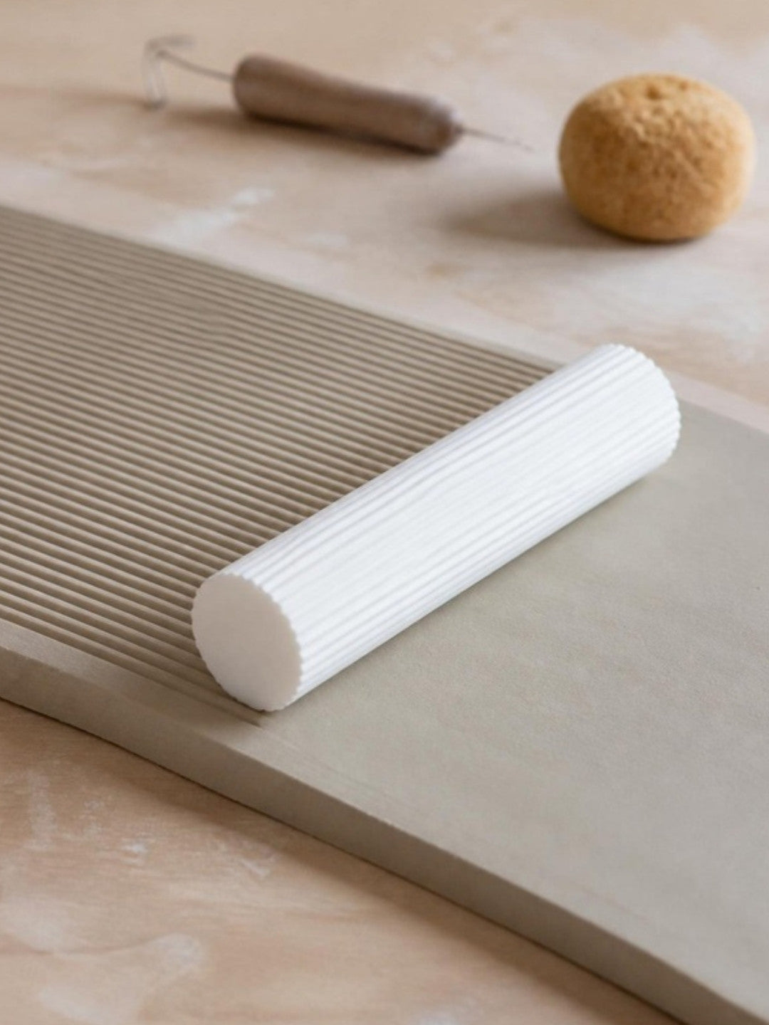 Stoneware clay slab textured with the Prop Options reeded clay texture roller