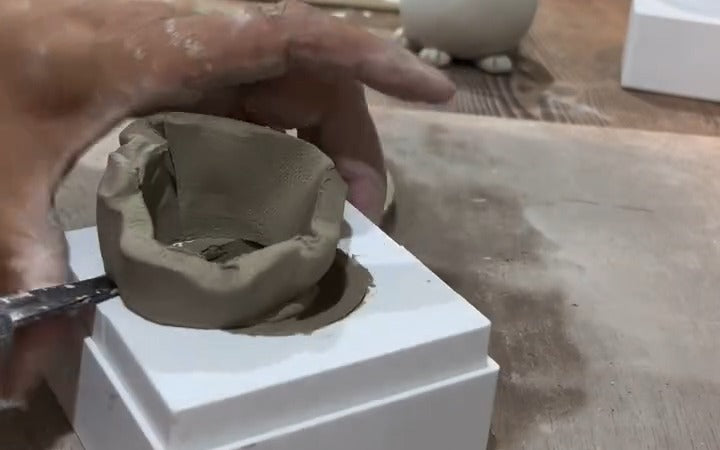 Karen Wiltshire trimming clay in the Prop Options sphere split mould