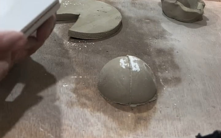A smooth clay hemisphere released from the sphere split mould