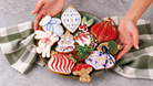 Decorated Christmas cookie platter on a gingham cloth, Prop Options x Ekat's Christmas cookie set